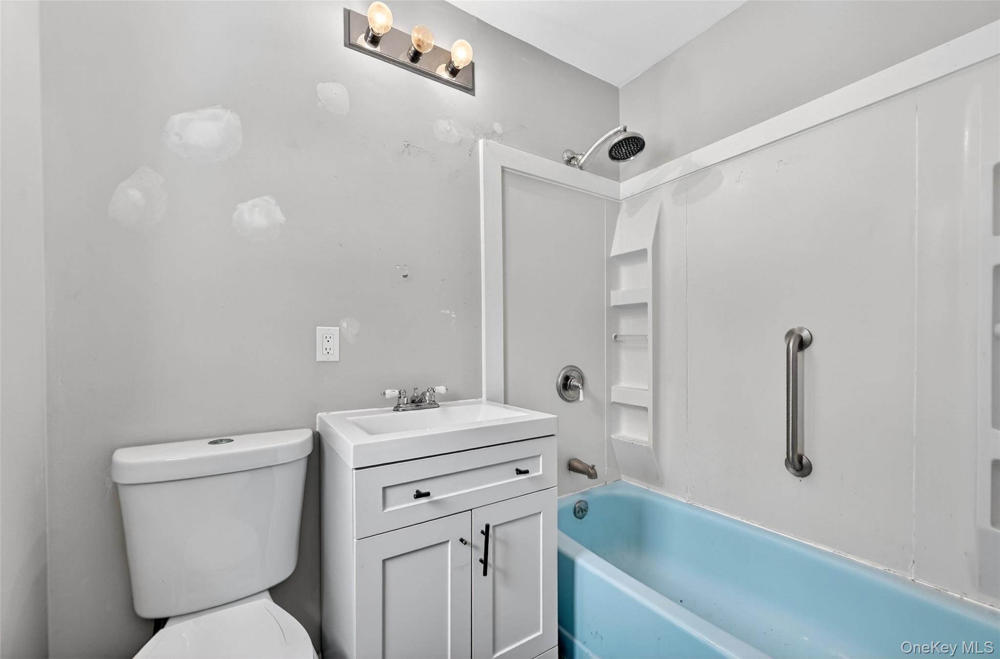 917 Scotchtown Collabar Road Middletown, NY 10941 - Photo 23 of 33 a bathroom with a sink toilet vanity and tub