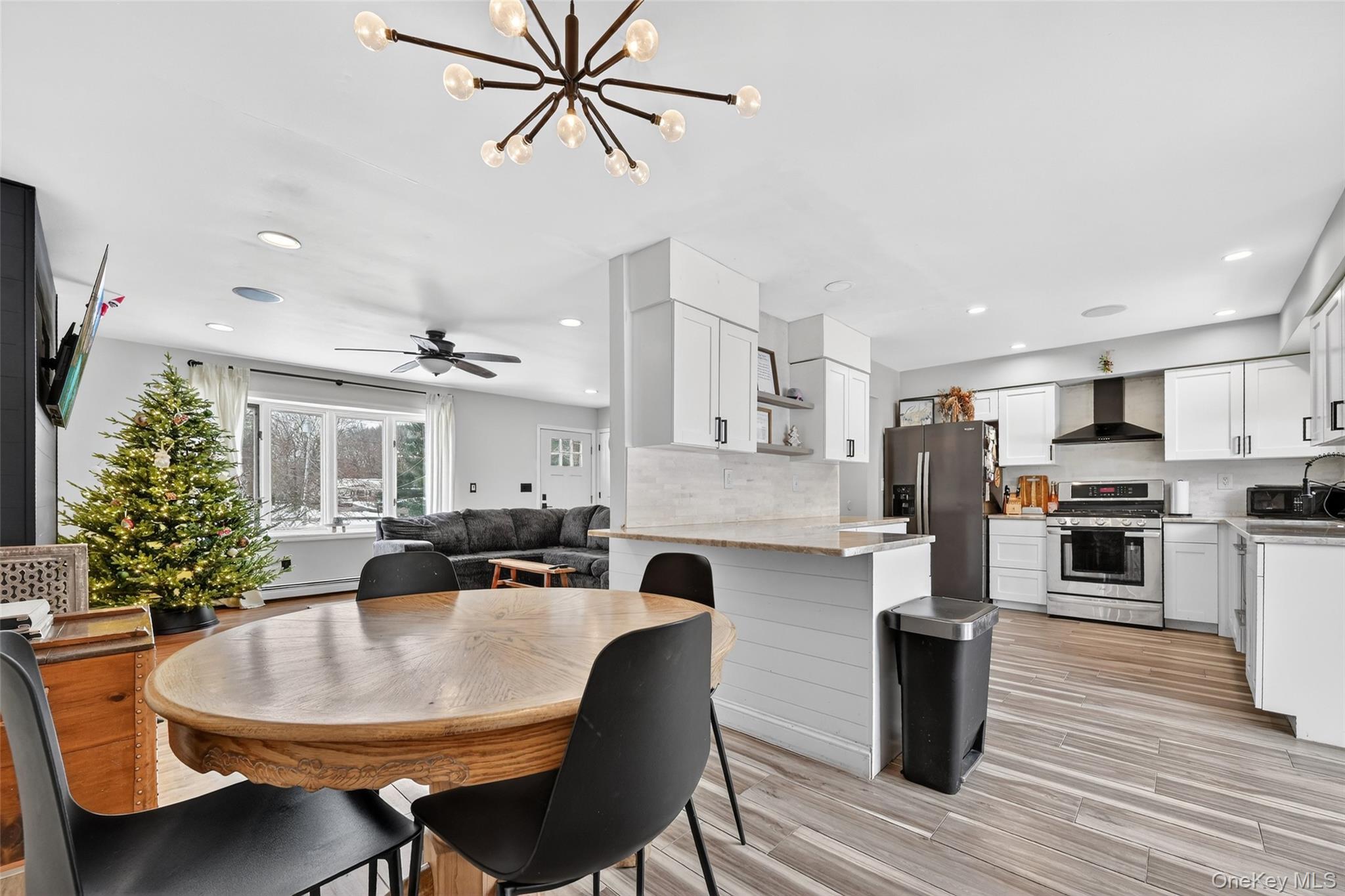 917 Scotchtown Collabar Road Middletown, NY 10941 - Photo 10 of 33 a kitchen with kitchen island a stove a table and chairs