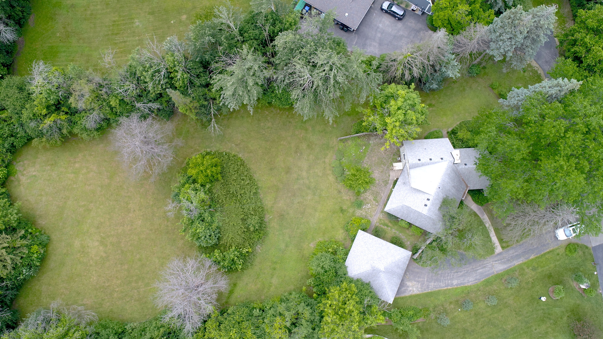 853 Cramer Court Willowbrook, IL 60527 - Photo 4 of 27 an aerial view of a house with a yard and lake view
