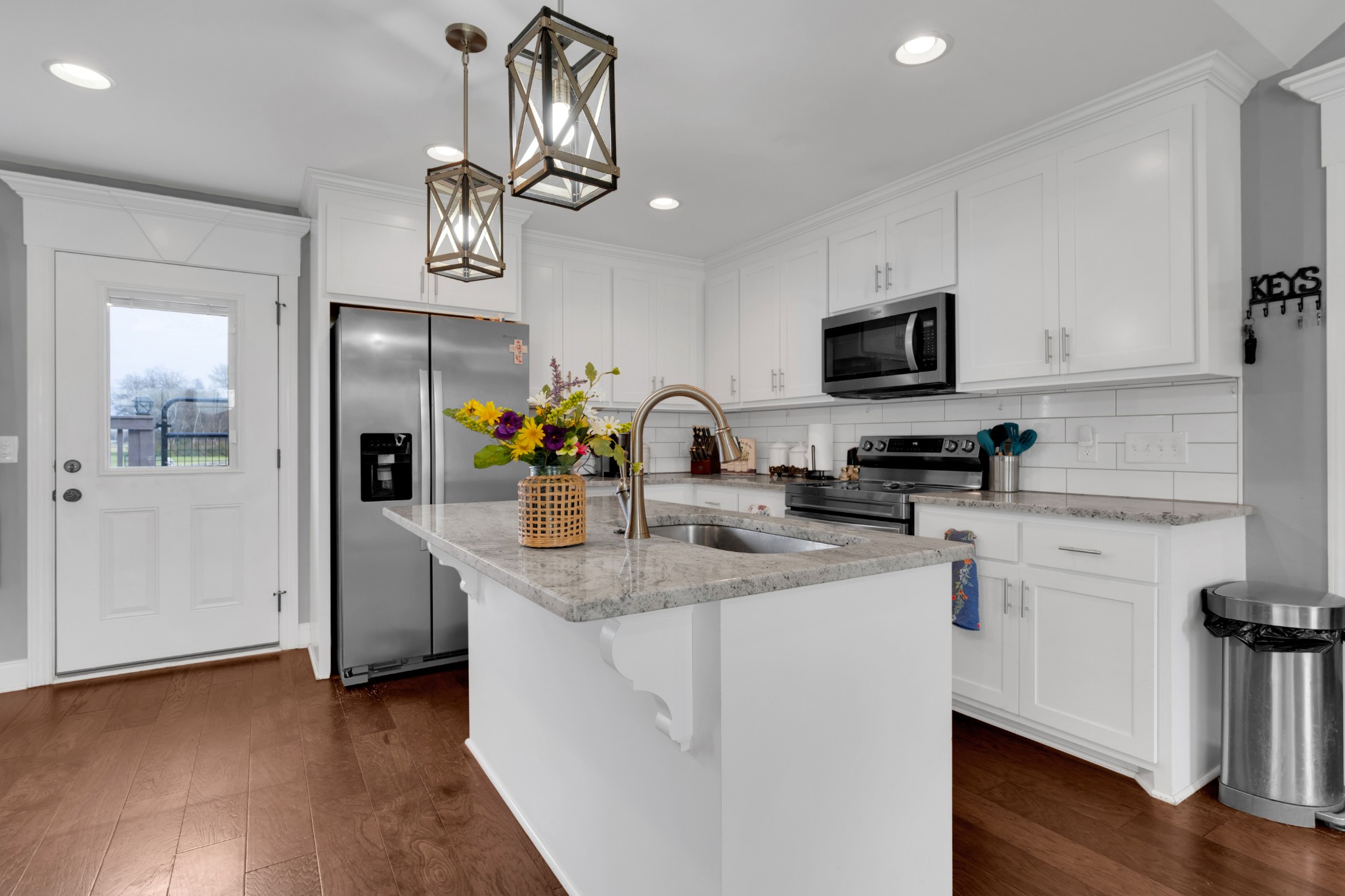 2058 Halls Mill Road Unionville, TN 37180 - Photo 26 of 67 a kitchen with stainless steel appliances granite countertop a refrigerator a stove top oven a sink and dishwasher