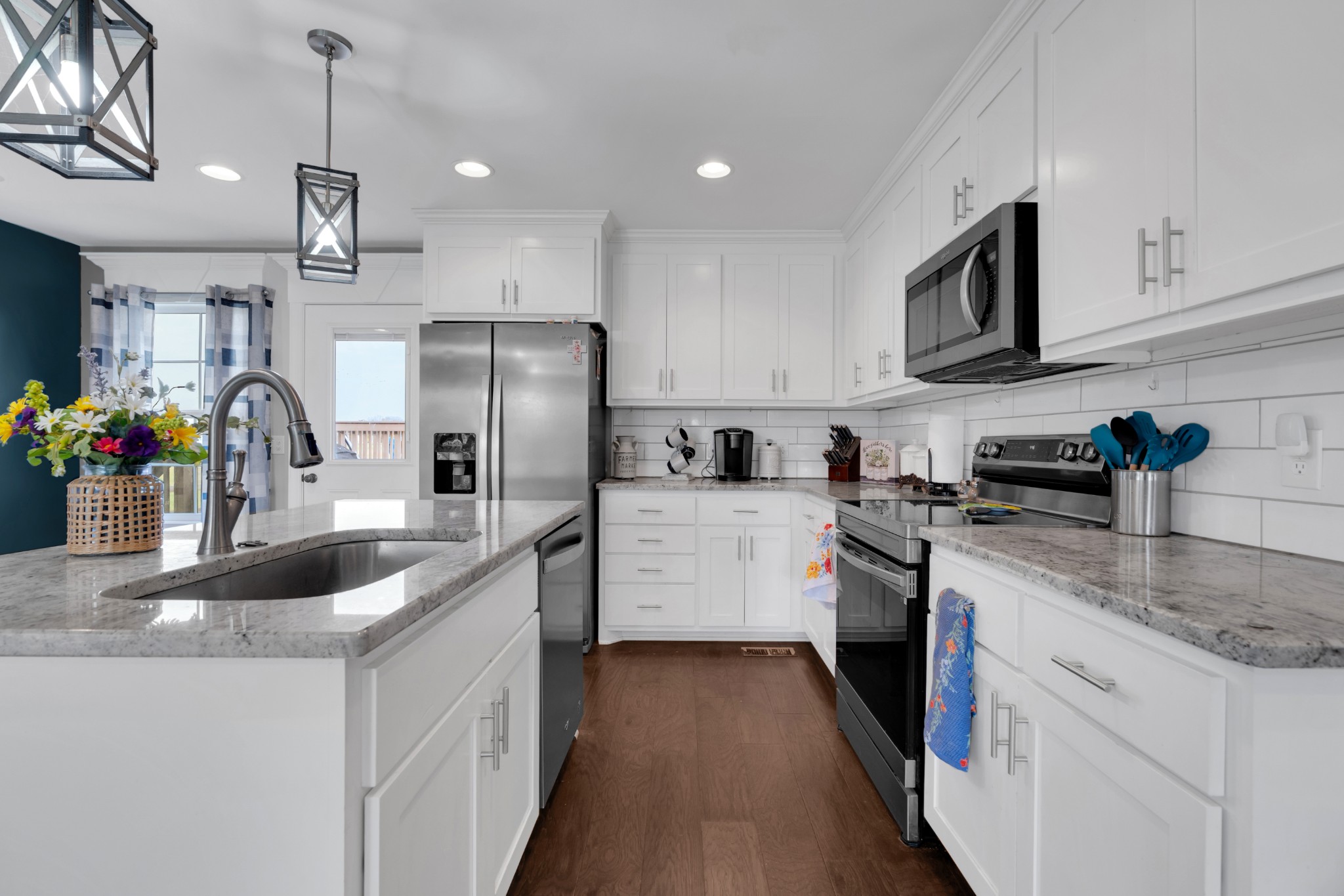 2058 Halls Mill Road Unionville, TN 37180 - Photo 27 of 67 a kitchen with cabinets a sink and stainless steel appliances