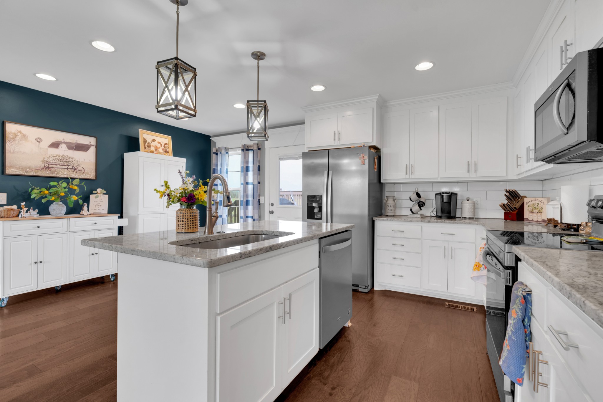 2058 Halls Mill Road Unionville, TN 37180 - Photo 29 of 67 a kitchen with stainless steel appliances granite countertop a sink a stove and a refrigerator