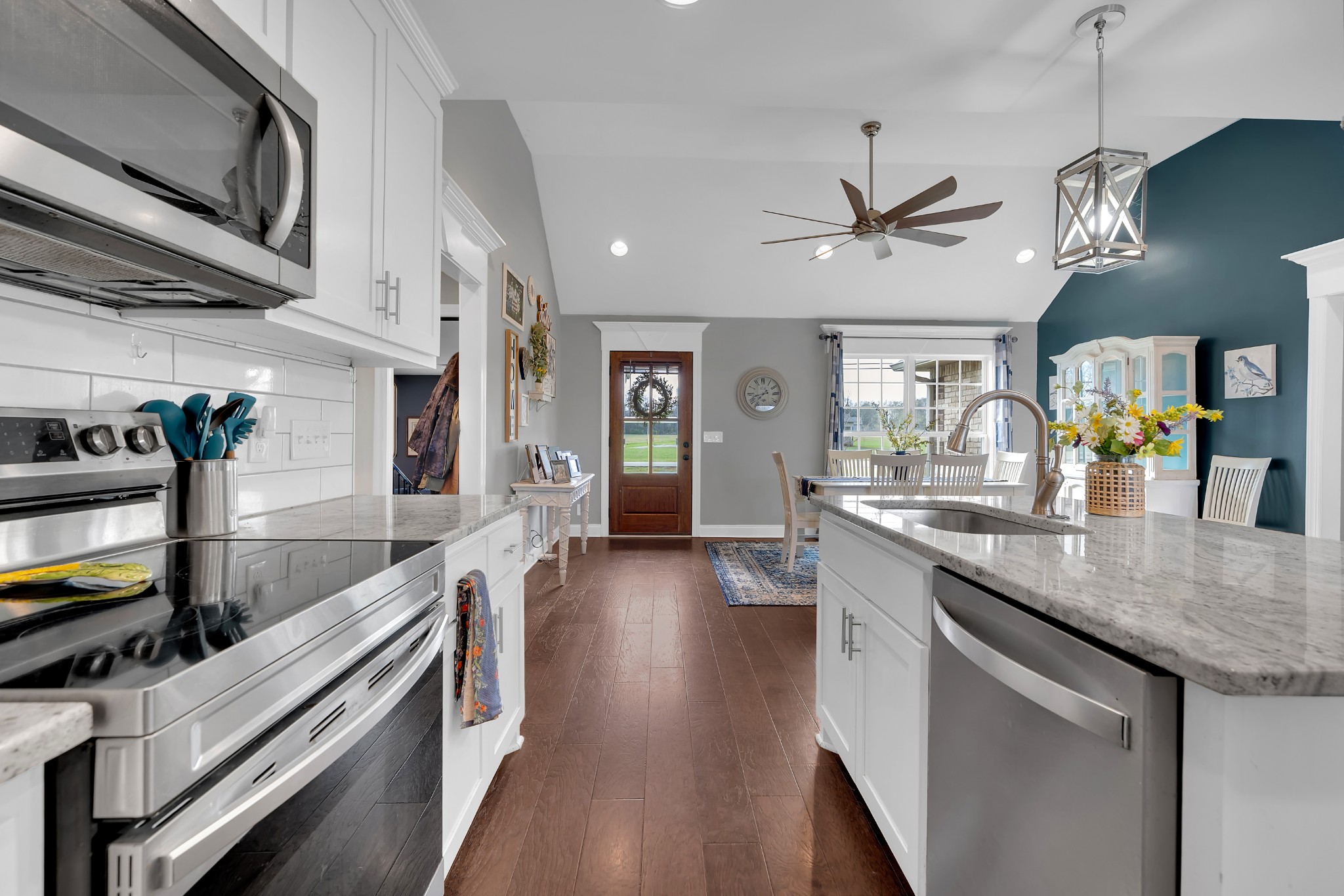 2058 Halls Mill Road Unionville, TN 37180 - Photo 30 of 67 a large kitchen with stainless steel appliances granite countertop a lot of counter space and wooden floor
