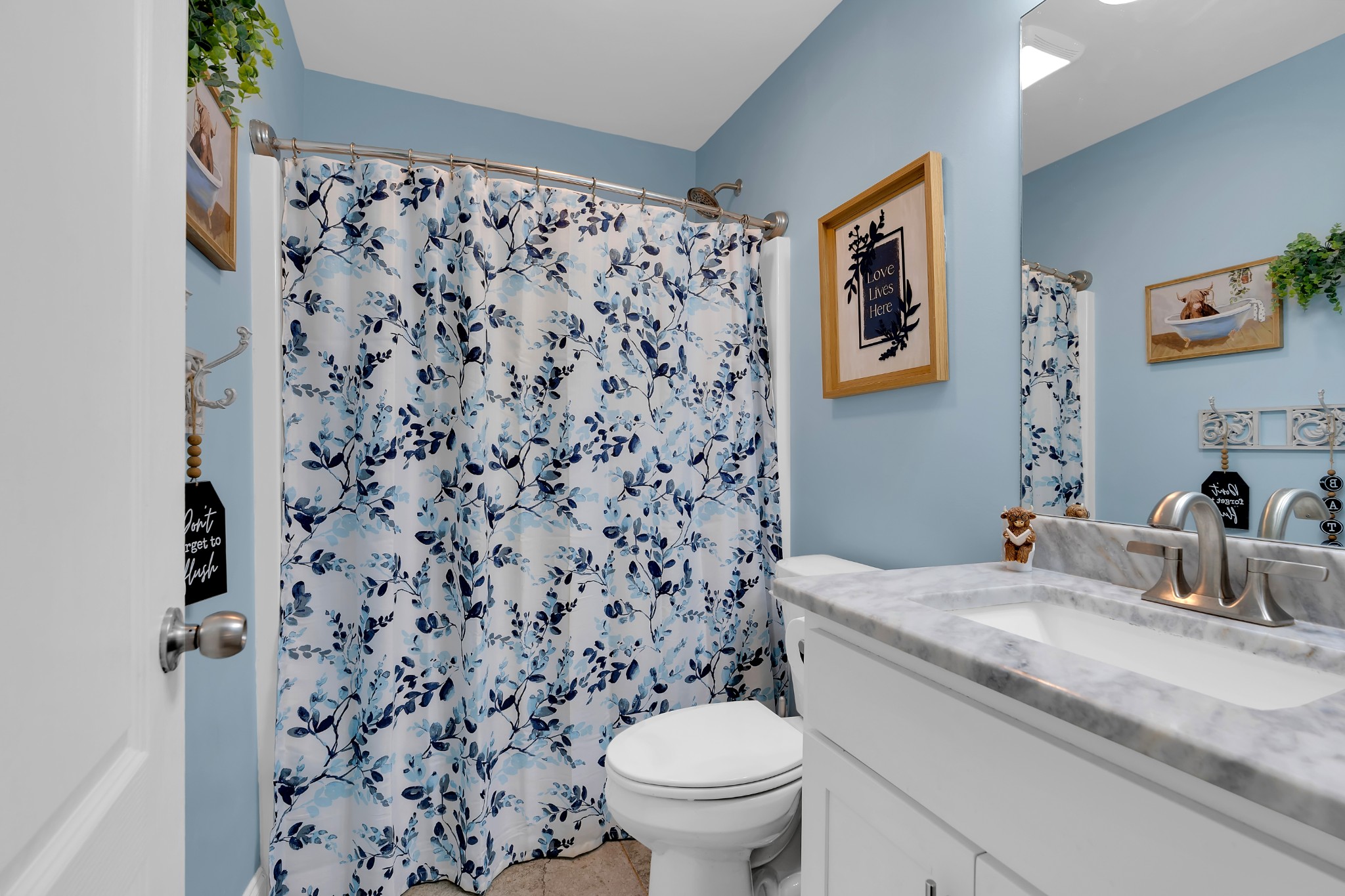 2058 Halls Mill Road Unionville, TN 37180 - Photo 35 of 67 a bathroom with a granite countertop toilet a sink and a mirror