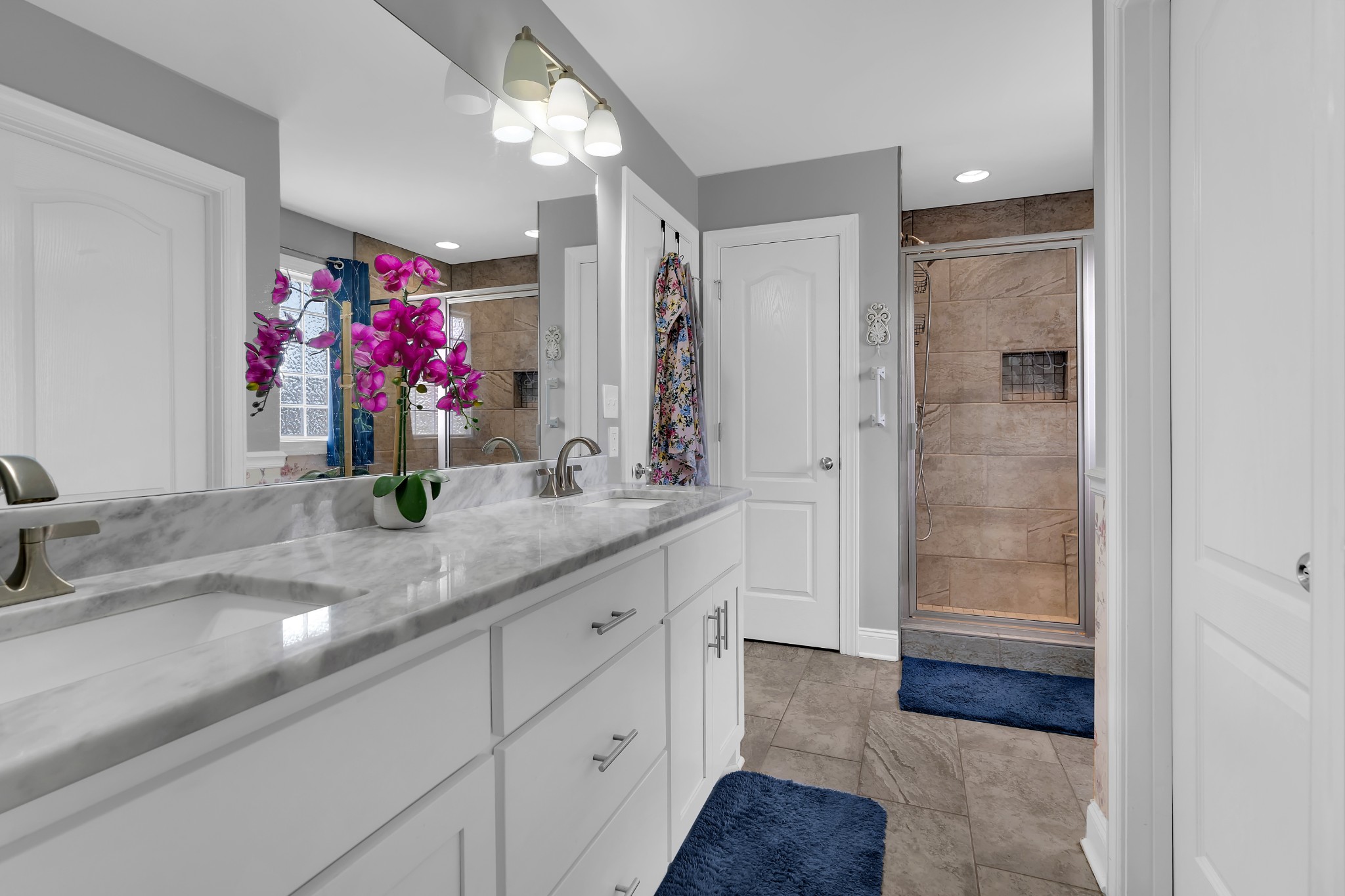 2058 Halls Mill Road Unionville, TN 37180 - Photo 43 of 67 a bathroom with a granite countertop sink a mirror and a shower