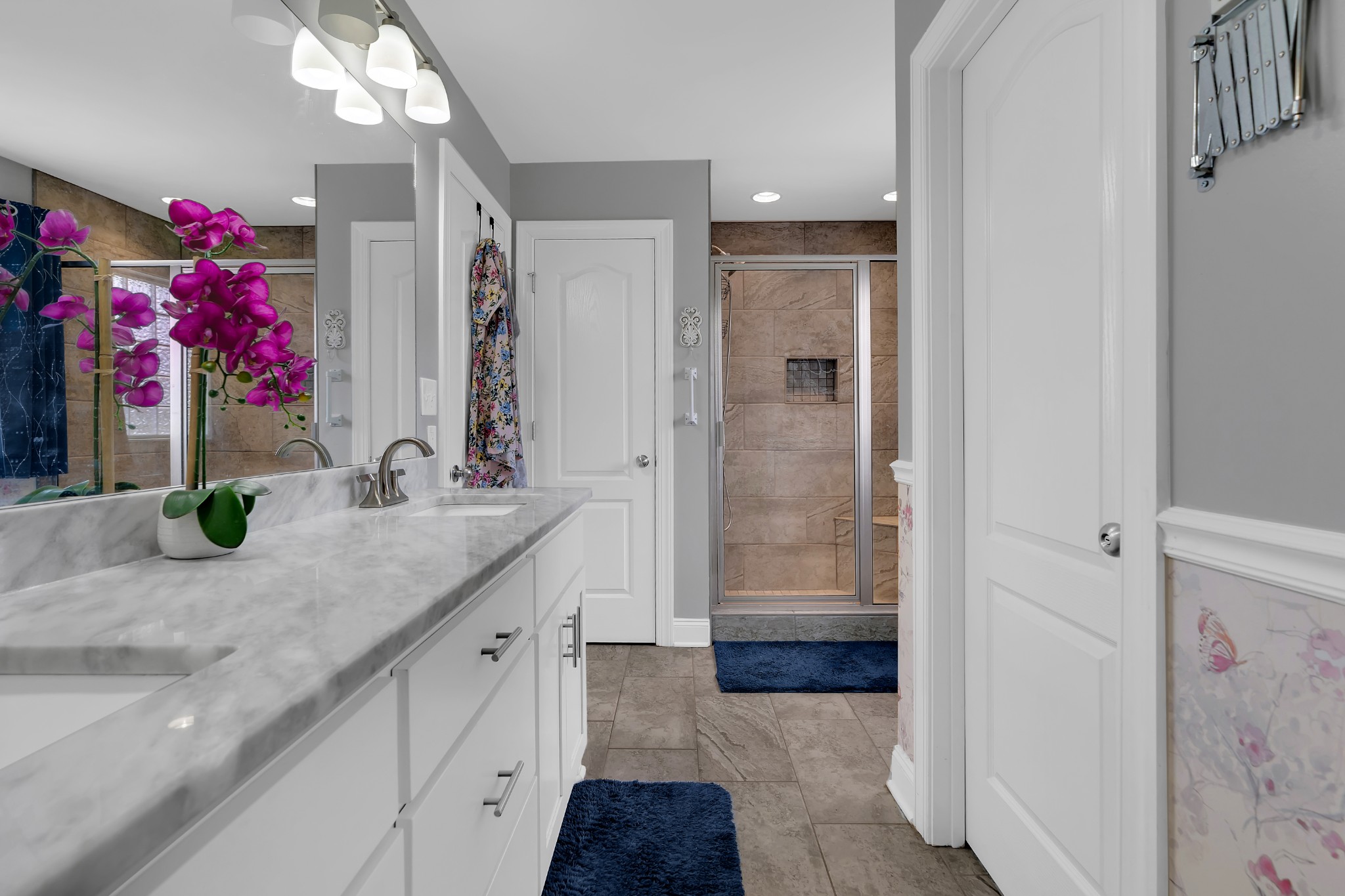 2058 Halls Mill Road Unionville, TN 37180 - Photo 44 of 67 a bathroom with a granite countertop sink a large mirror and a shower