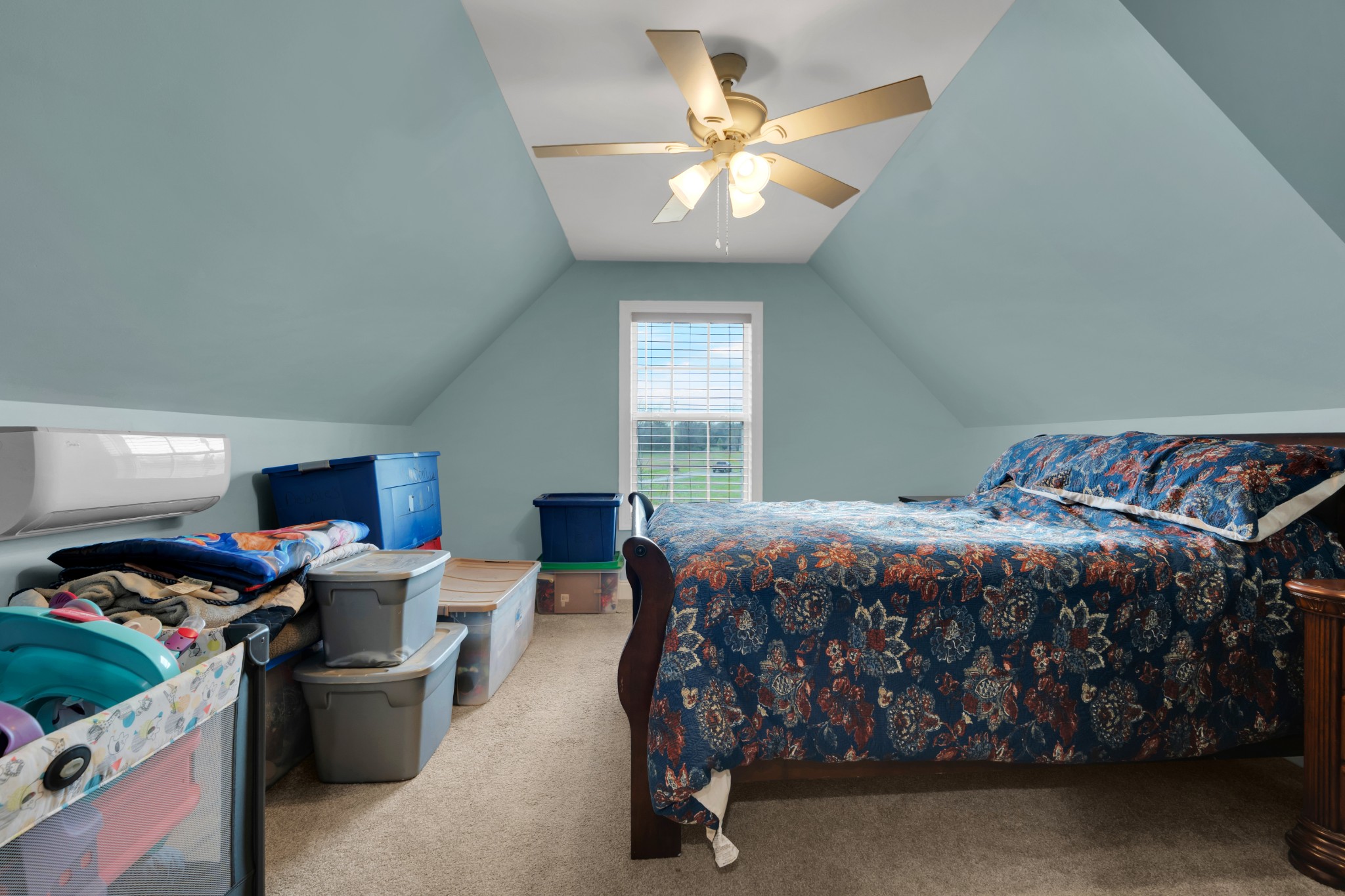 2058 Halls Mill Road Unionville, TN 37180 - Photo 52 of 67 a bed room with a bed and a chandelier