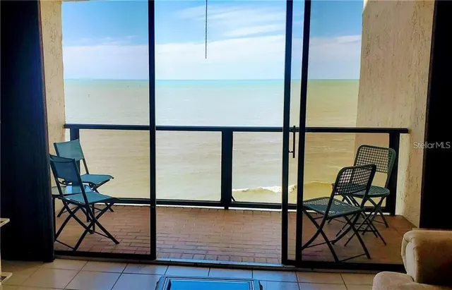 a view of a living room with furniture and a window