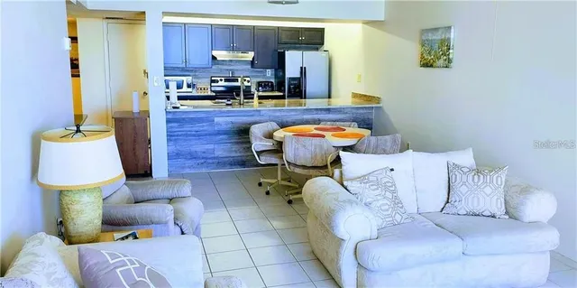 a living room with furniture and a lamp