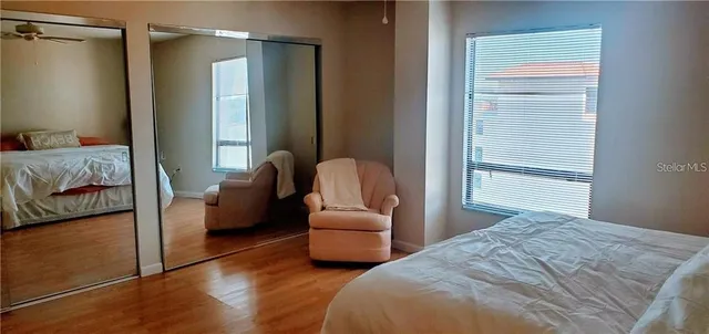 a bedroom with bed and window