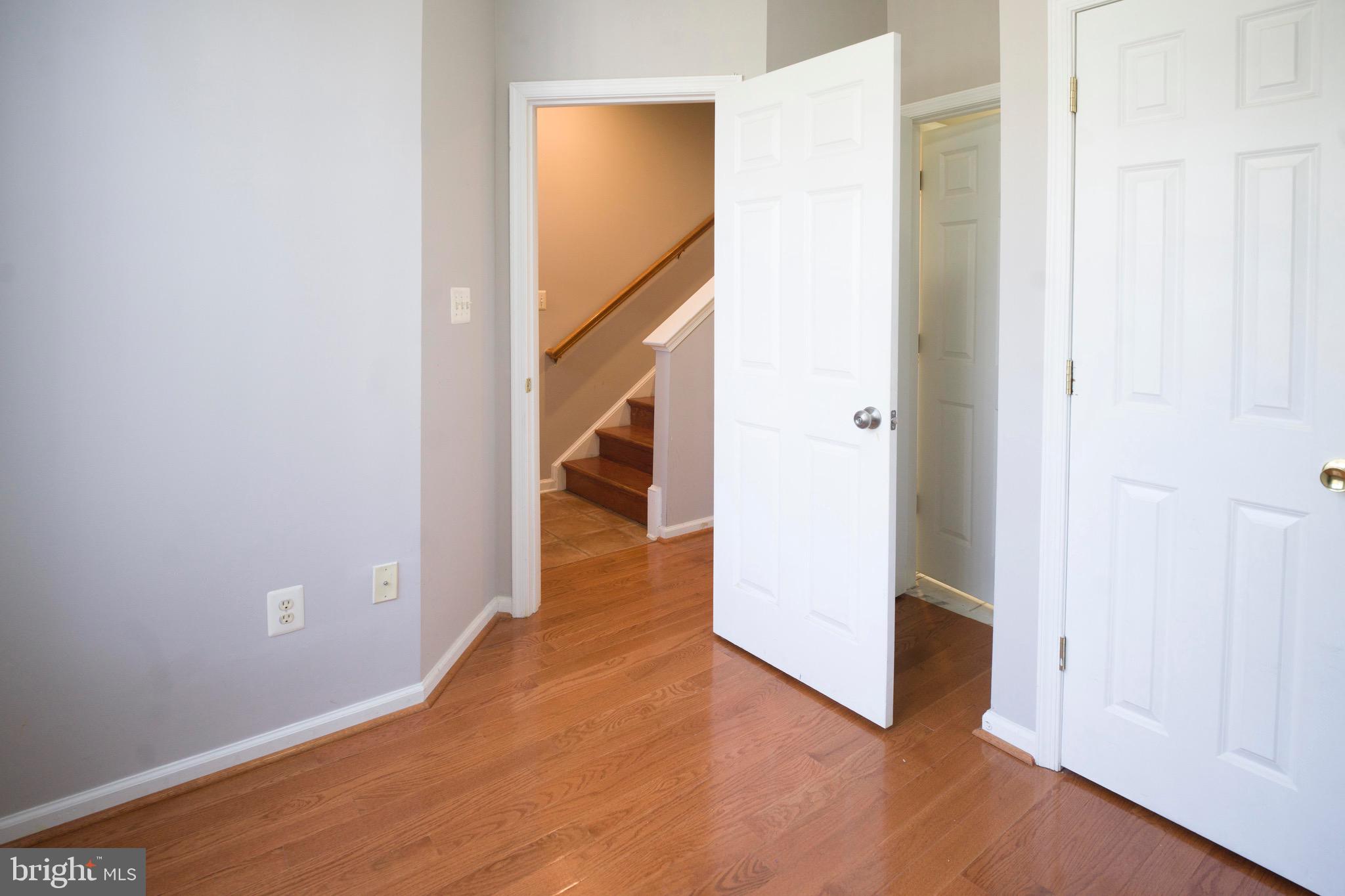 4281 South Capitol Street Southwest Washington, DC 20032 - Photo 4 of 71 a view of a hallway with wooden floor and entryway