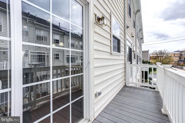 a bedroom with a bed and a flat tv screen on dresser
