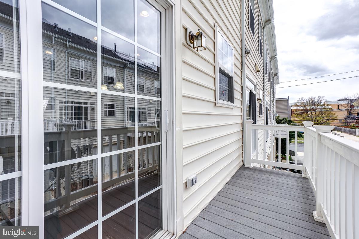 4281 South Capitol Street Southwest Washington, DC 20032 - Photo 43 of 71 a view of a balcony with wooden floor and fence