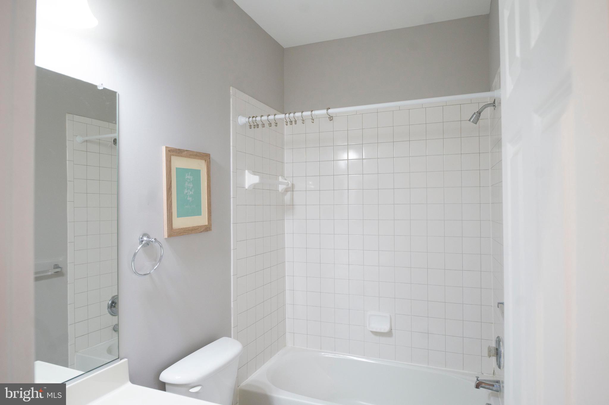 4281 South Capitol Street Southwest Washington, DC 20032 - Photo 6 of 71 a bathroom with a shower and a toilet