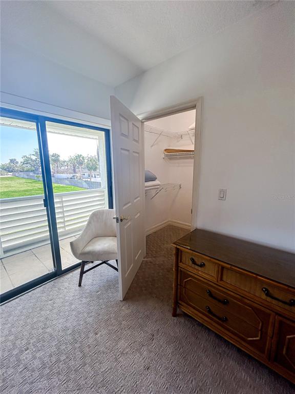 7303 Midnight Pass Road Sarasota, FL 34242 - Photo 19 of 22 a room with furniture and a window