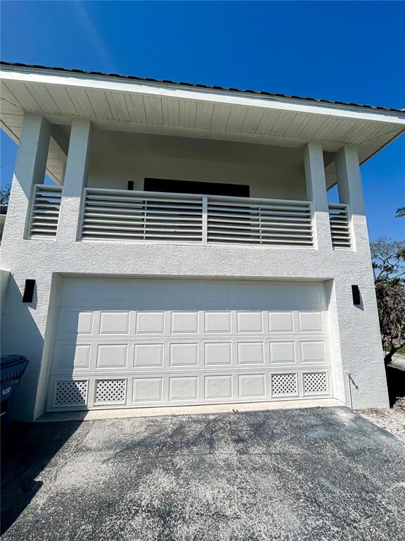 7303 Midnight Pass Road Sarasota, FL 34242 - Photo 22 of 22 a front view of a house