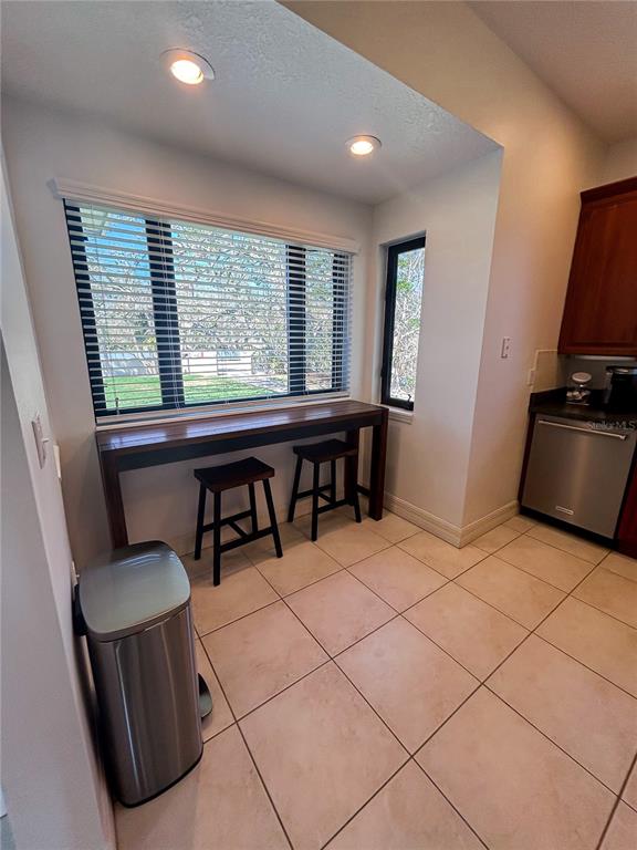 7303 Midnight Pass Road Sarasota, FL 34242 - Photo 6 of 22 a view of a workspace with furniture and a window