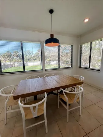a bedroom with a large bed and a large window