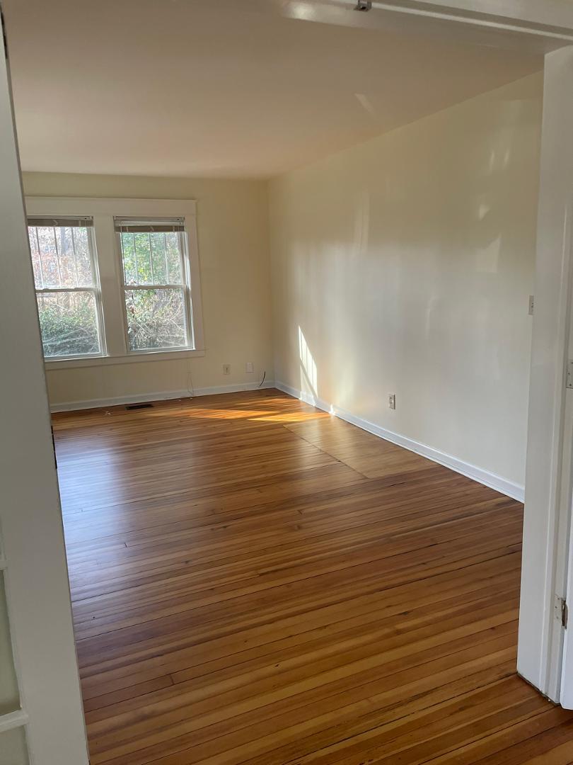 716 Crosby Road Durham, NC 27704 - Photo 11 of 17 wooden floor in an empty room with a window
