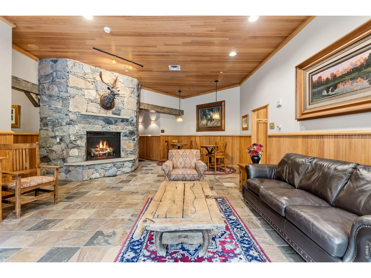 195 River Run Road, Unit 8006 Keystone, CO 80435 - Photo 18 of 33 A shared lounge with a grand stone fireplace