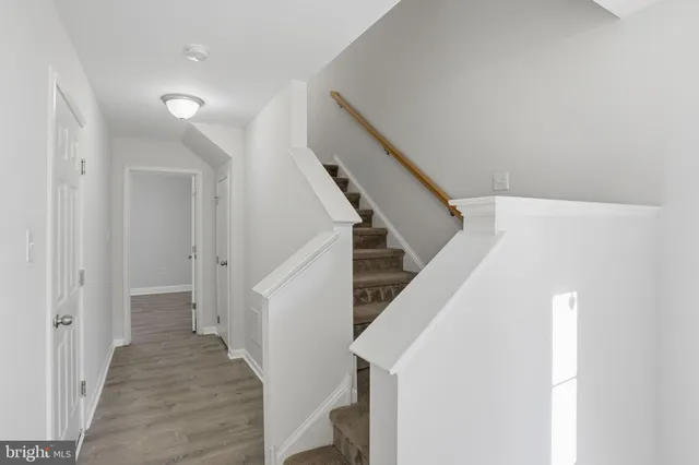 a view of a hallway with staircase