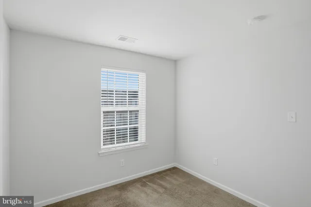 a view of a room that has a window in it