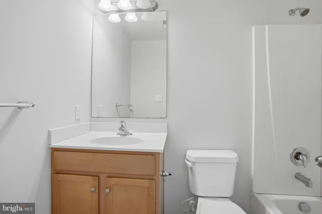 a bathroom with a sink toilet and vanity