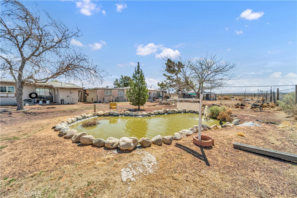 26447 Twenty Mule Team Road Boron, CA 93516 - Photo 19 of 61 a view of a swimming pool and lounge chair