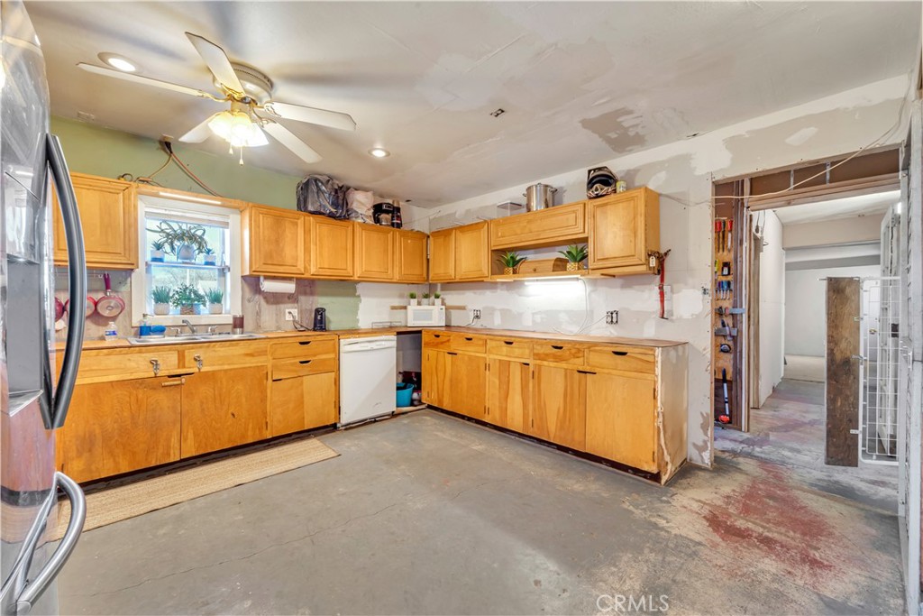 26447 Twenty Mule Team Road Boron, CA 93516 - Photo 30 of 61 a kitchen with cabinets a sink and appliances