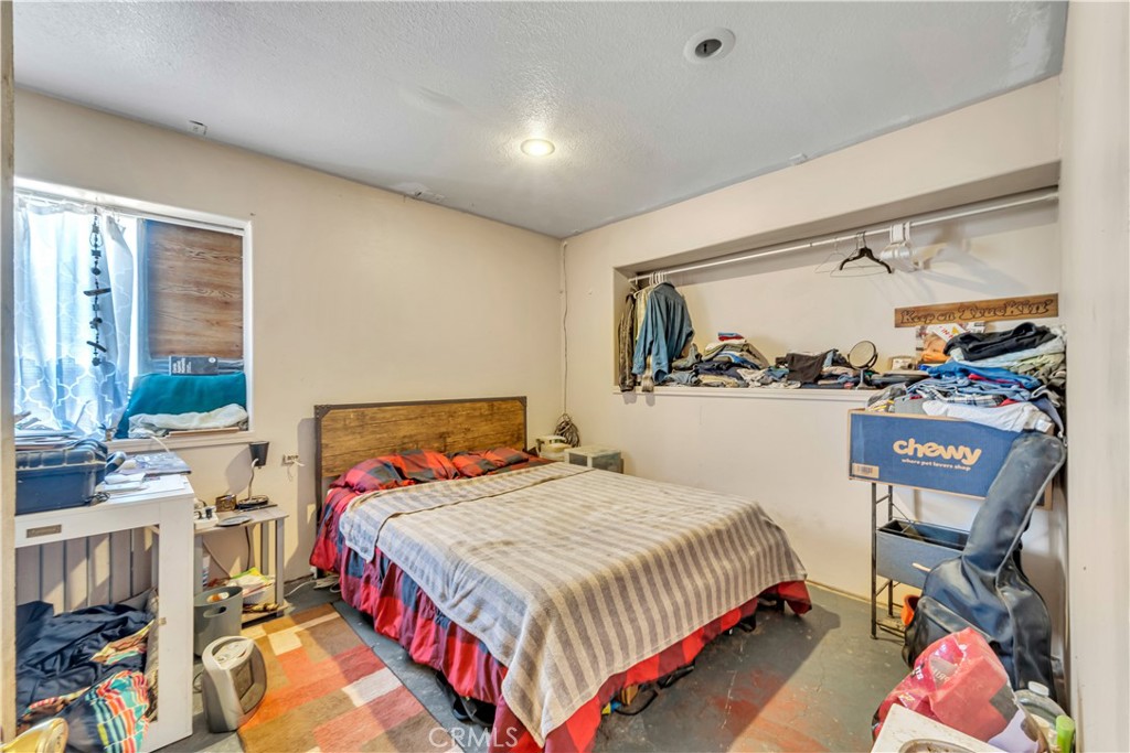 26447 Twenty Mule Team Road Boron, CA 93516 - Photo 33 of 61 a bedroom with a bed and a window