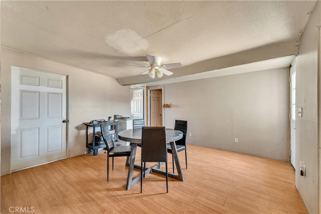 26447 Twenty Mule Team Road Boron, CA 93516 - Photo 34 of 61 a view of a dining room with furniture and wooden floor