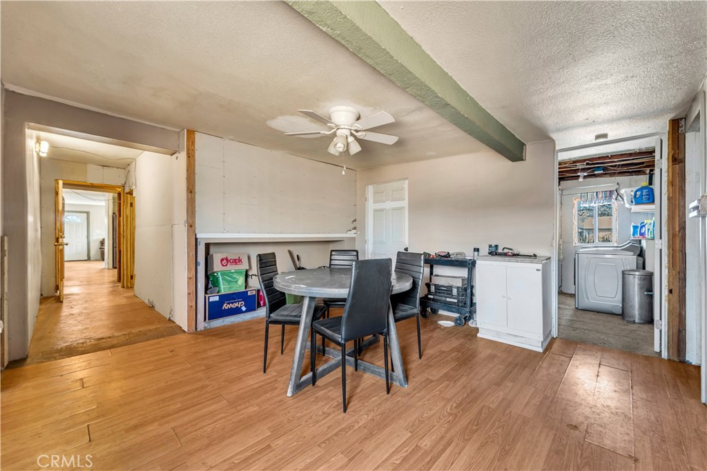 26447 Twenty Mule Team Road Boron, CA 93516 - Photo 35 of 61 a view of a dining room with furniture and wooden floor
