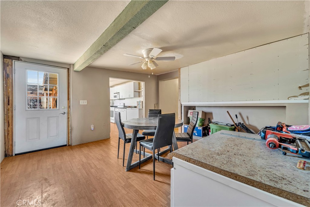 26447 Twenty Mule Team Road Boron, CA 93516 - Photo 36 of 61 a view of a dining room with furniture and wooden floor