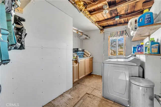 a kitchen with a sink and a stove top oven