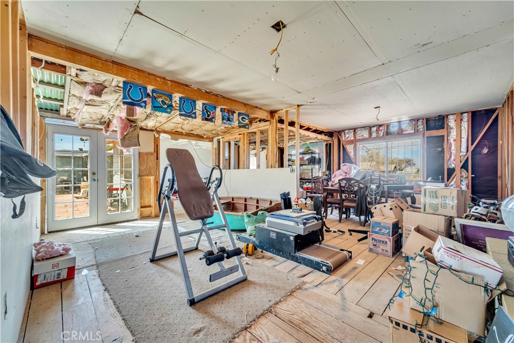 26447 Twenty Mule Team Road Boron, CA 93516 - Photo 49 of 61 a living room with lots of furniture and a flat screen tv