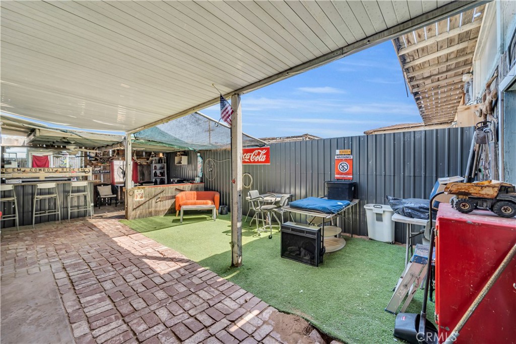 26447 Twenty Mule Team Road Boron, CA 93516 - Photo 55 of 61 a view of a backyard with a patio and outdoor seating