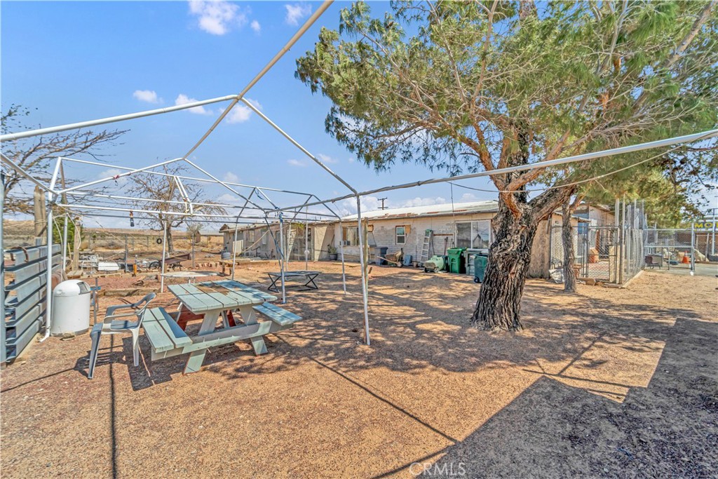 26447 Twenty Mule Team Road Boron, CA 93516 - Photo 10 of 61 a view of a patio with a table and chairs