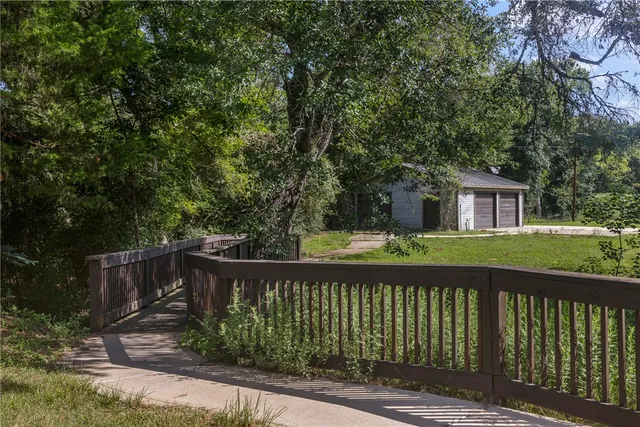 a view of a house with a yard and sitting area