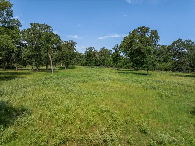 an aerial view of a house having yard
