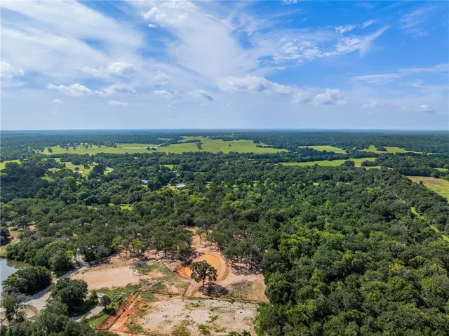 a view of a lake with a yard