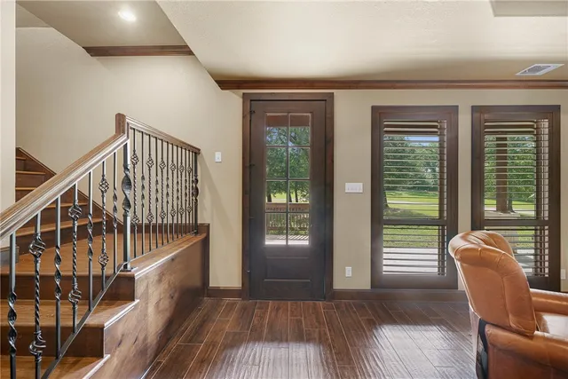a view of balcony with wooden floor and windows