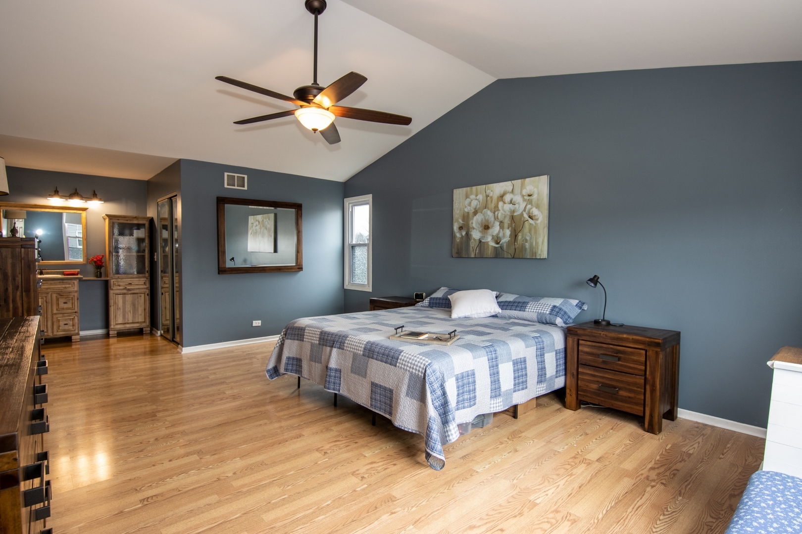 619 Chatham Circle Algonquin, IL 60102 - Photo 19 of 37 a bedroom with a bed and a chandelier