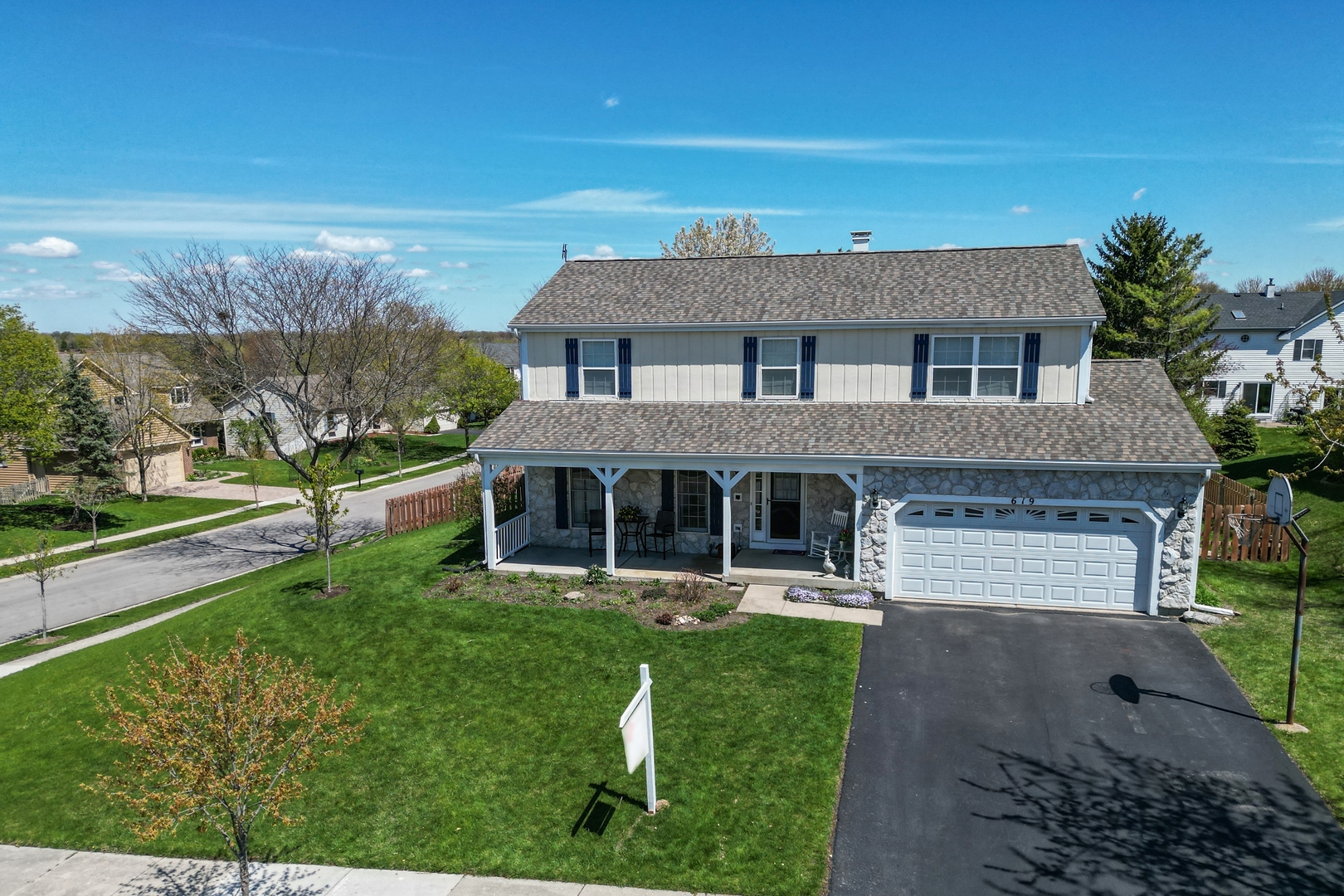 619 Chatham Circle Algonquin, IL 60102 - Photo 2 of 37 a front view of a house with a yard