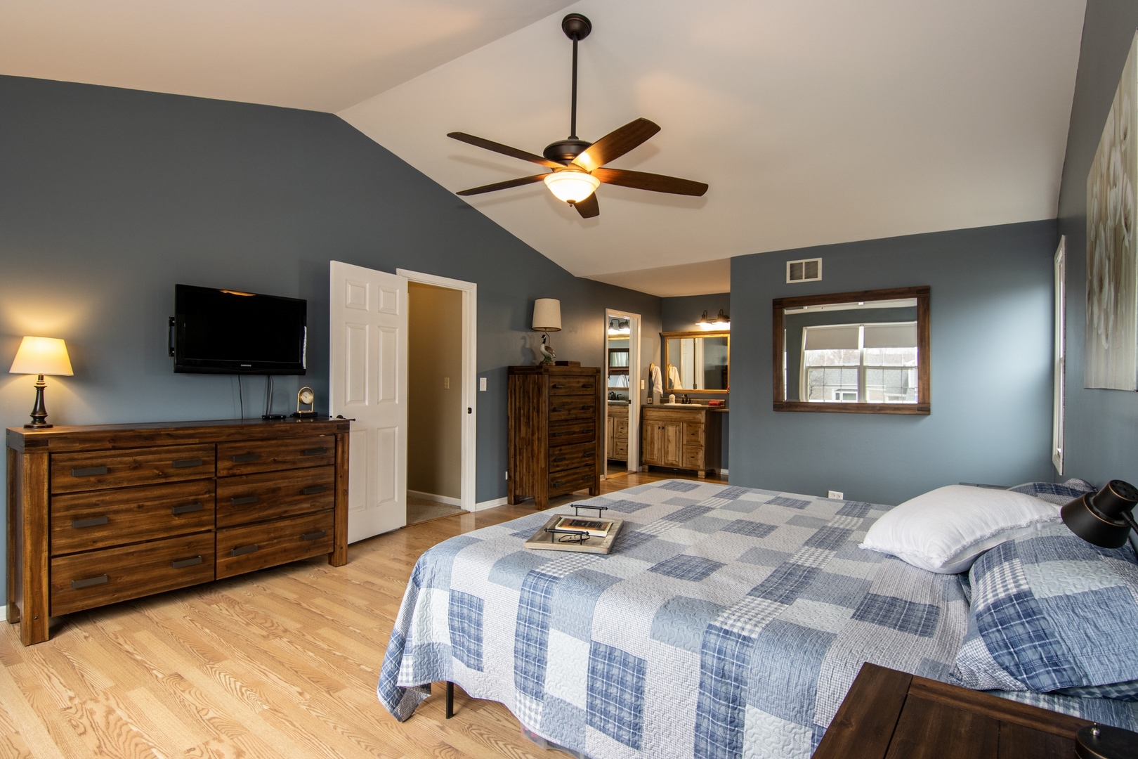 619 Chatham Circle Algonquin, IL 60102 - Photo 21 of 37 a bedroom with a bed a dresser and flat screen tv