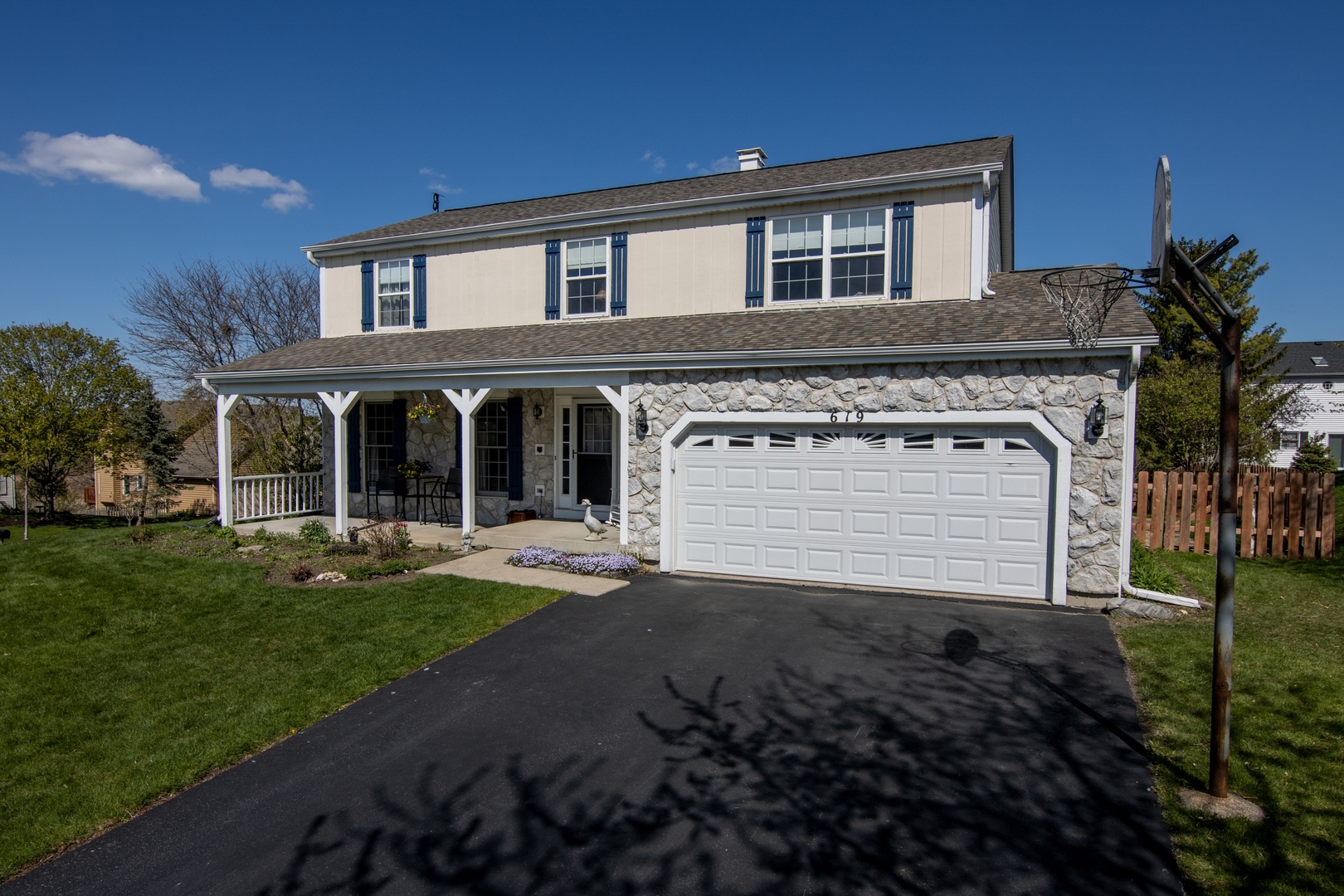 619 Chatham Circle Algonquin, IL 60102 - Photo 3 of 37 a front view of a house with a yard and garage