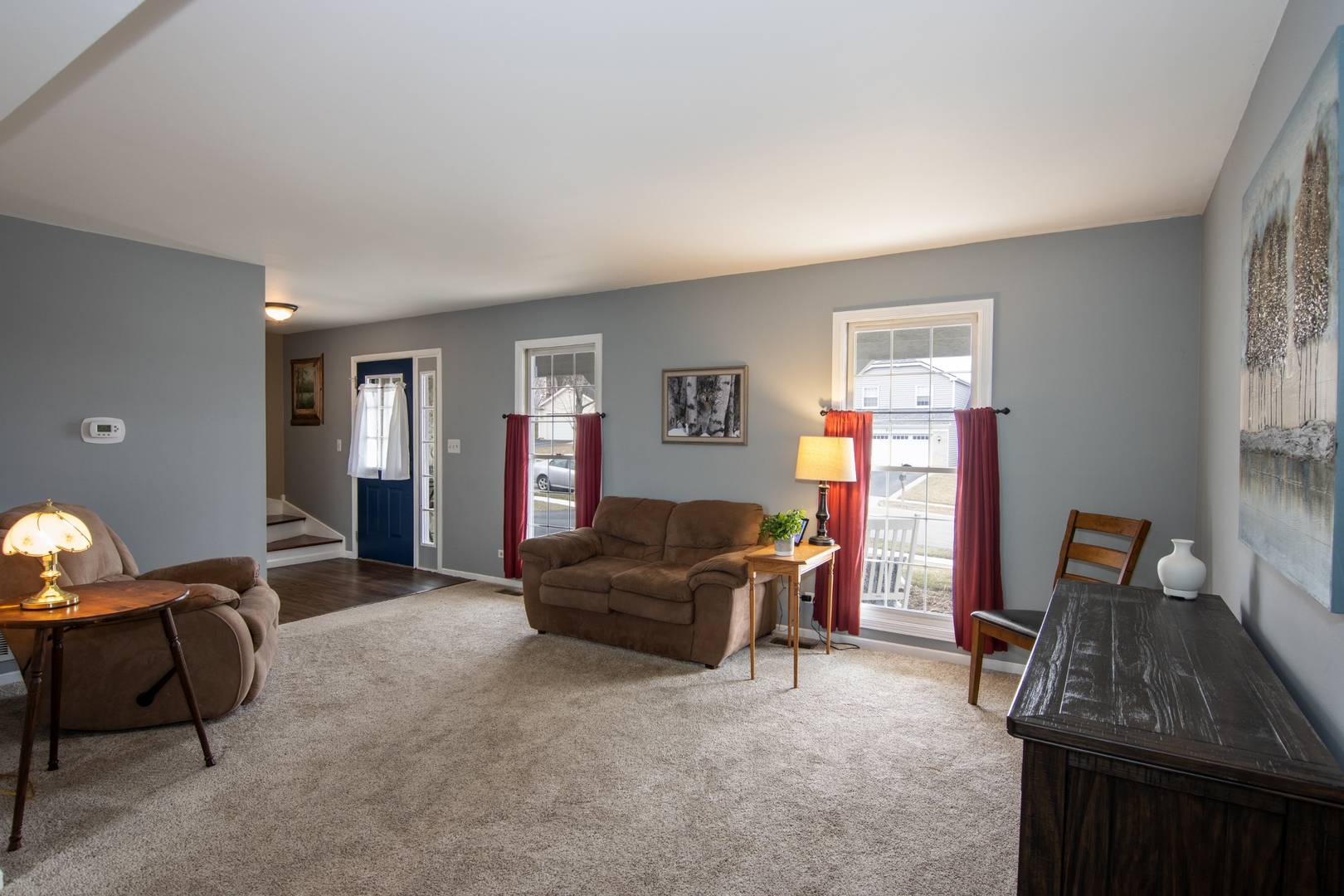 619 Chatham Circle Algonquin, IL 60102 - Photo 10 of 37 a living room with furniture and a flat screen tv