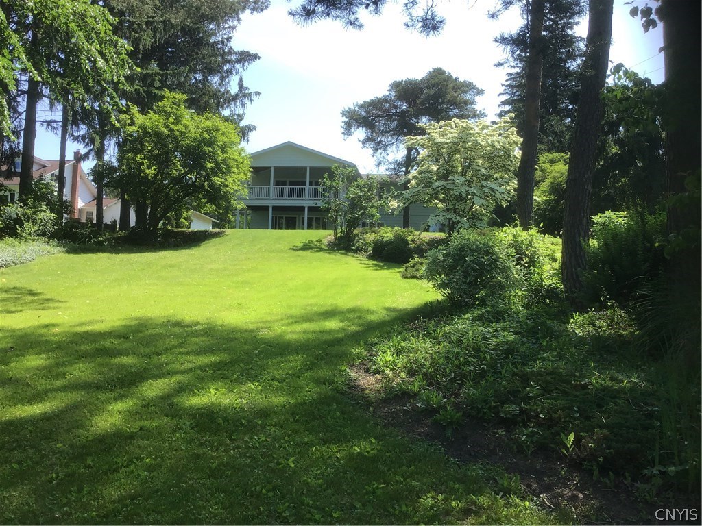 4903 Rockefeller Road Owasco, NY 13021 - Photo 1 of 1 Amazing covered porch and patio with views of beau