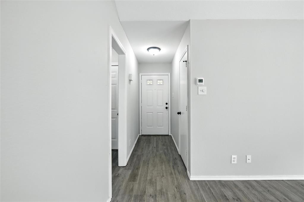 602 Valleyridge Court Decatur, TX 76234 - Photo 24 of 27 a view of a hallway with wooden floor