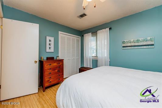 200 Atrium Court Warner Robins, GA 31088 - Photo 23 of 31 a bedroom with a bed and a dresser