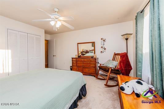 200 Atrium Court Warner Robins, GA 31088 - Photo 28 of 31 a bedroom with furniture and a gym equipment